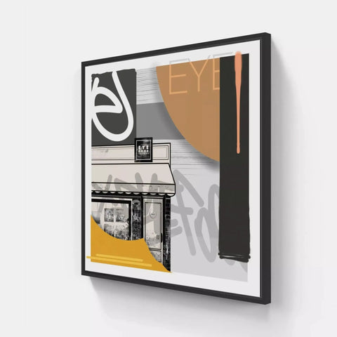 A framed print of a building with a yellow and black design