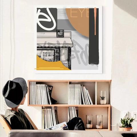 A person sitting at a desk with a bookcase