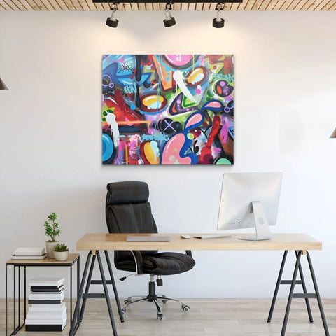 A painting on a wall above a desk