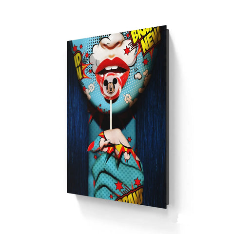 Pop art-style canvas print featuring bright red lips holding a Mickey Mouse lollipop.