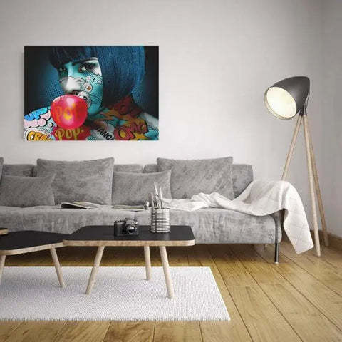 A living room with a couch and a painting on the wall