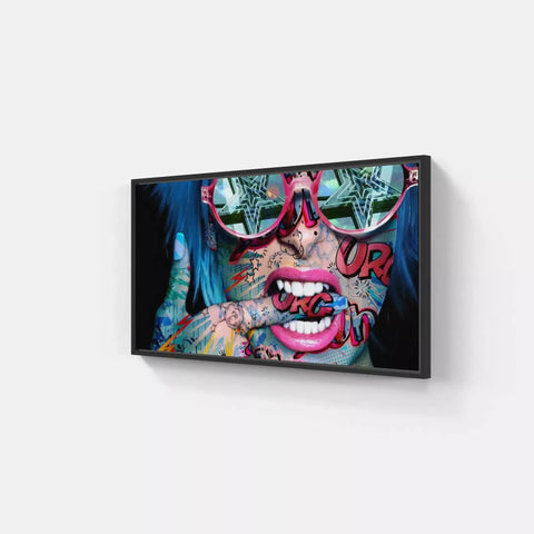 A black framed canvas with a colorful painting of a woman’s face