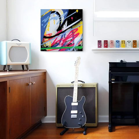 A guitar and a speaker in a room