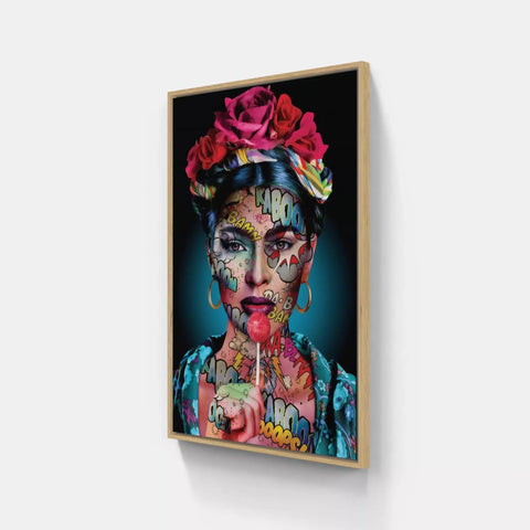 A framed canvas with a woman’s face painted in bright colors