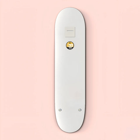 White electronic device resembling a sleek, elongated remote control with a small circular button.