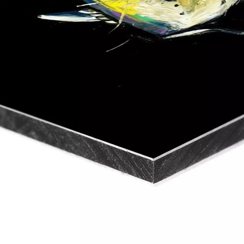 A black and white marble tile with a yellow fish