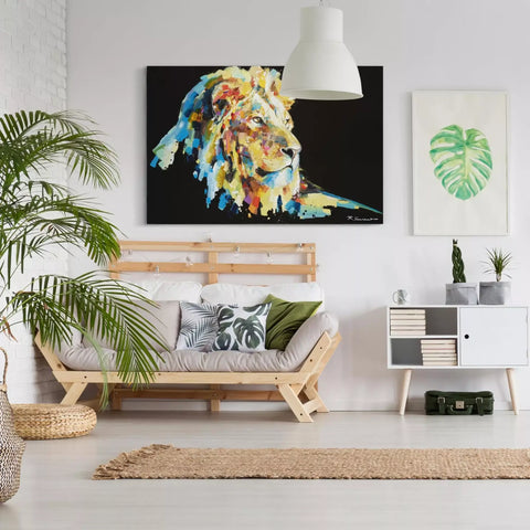 A living room with a couch, a large painting and a plant