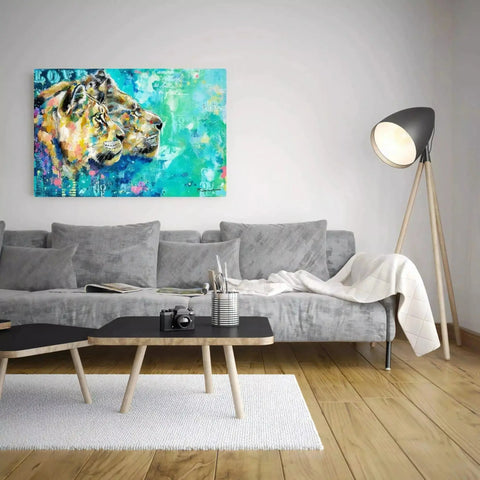 A living room with a couch and a painting on the wall