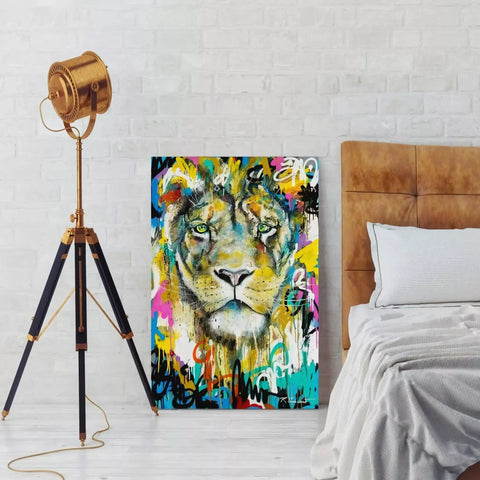 A colorful lion head on a wall in a bedroom