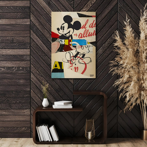 Colorful Mickey Mouse artwork canvas hanging on a wooden wall.