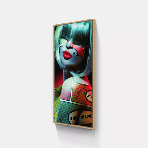 A framed print of a clown with a red nose