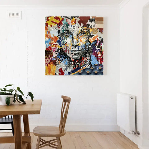 A painting on the wall above a dining table