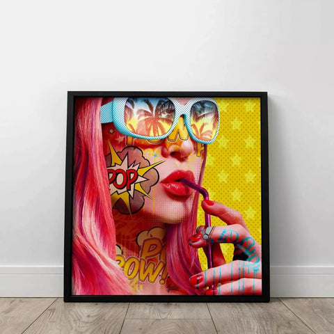 A framed print of a woman with pink hair and sunglasses