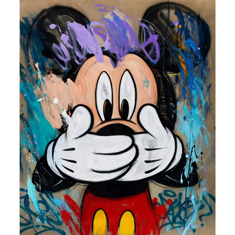 Mickey mouse painting on a wall with graffiti on it