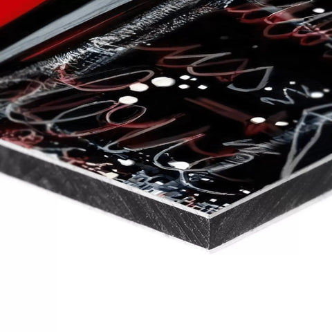 A black and red painting on a white surface