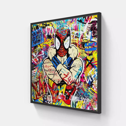 A large framed painting of a spider with graffiti on it