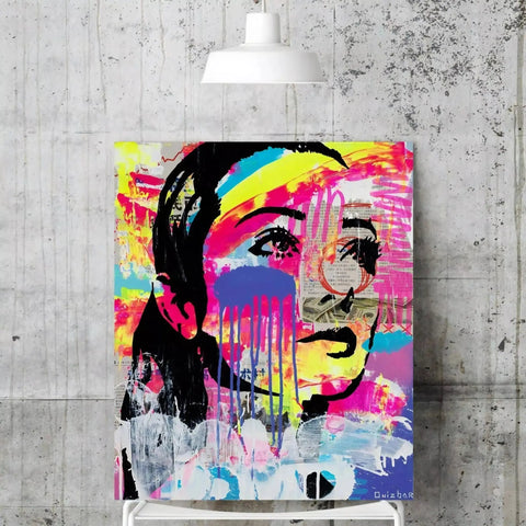 A painting of a woman’s face with colorful paint splats