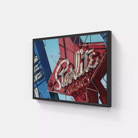 A framed picture of a neon sign on a wall