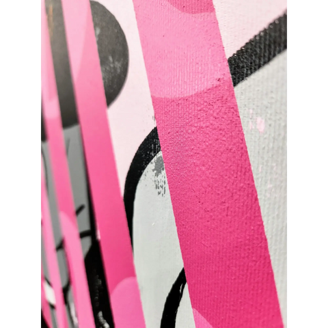 A close up of a pink and black abstract painting