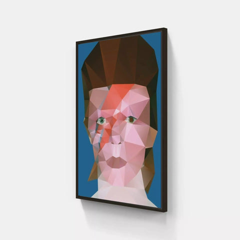 A framed print of a face of a man with a red and pink geometric pattern